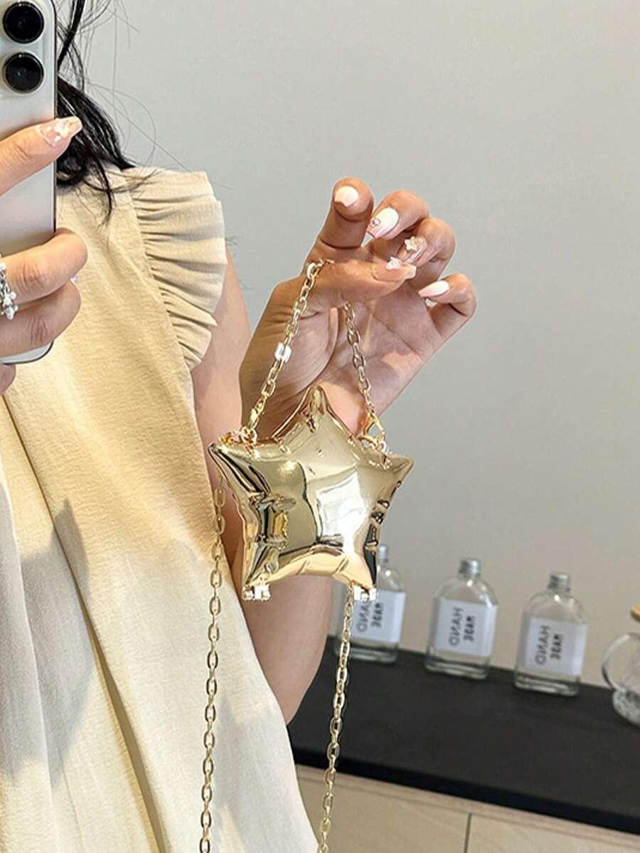 złota torebka gwiazda