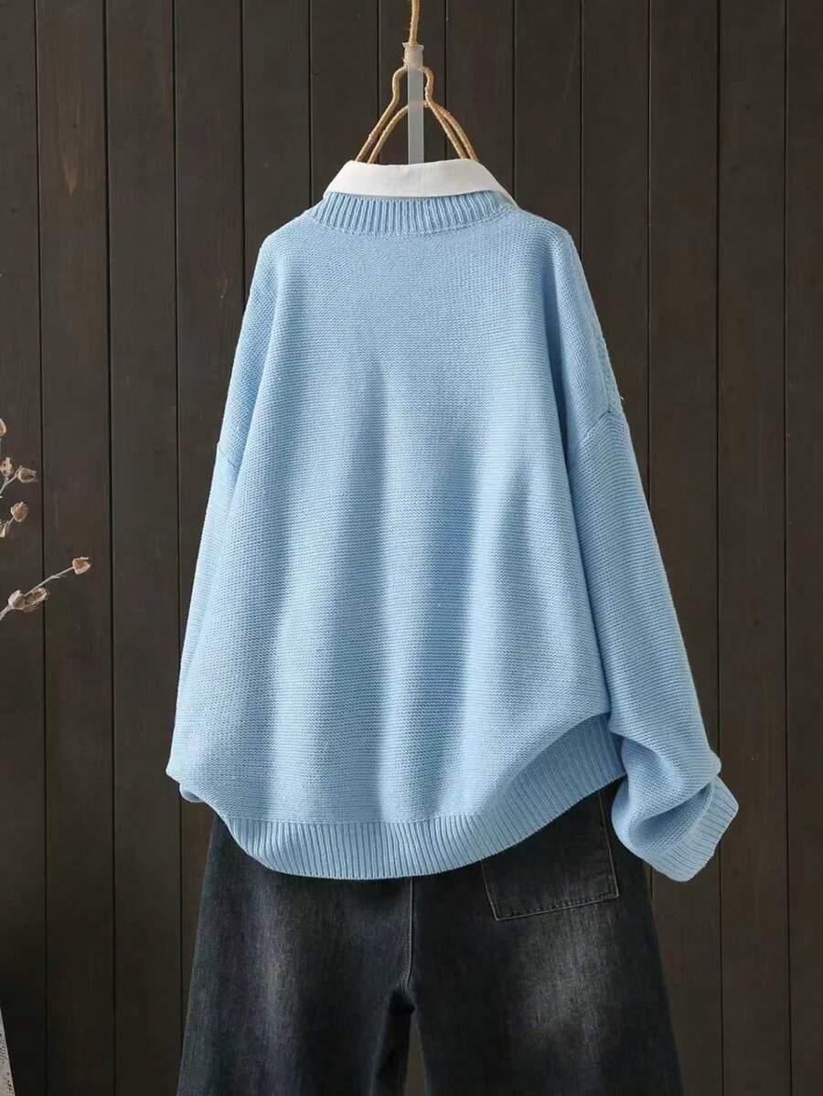 niebieski sweter oversize