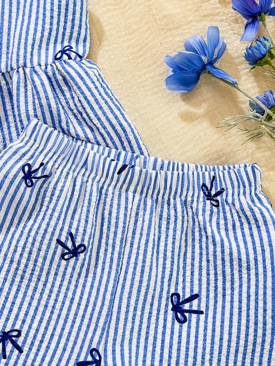 BLUZKA Z BASKINKĄ W PASKI I KOKARDKI 18-24M