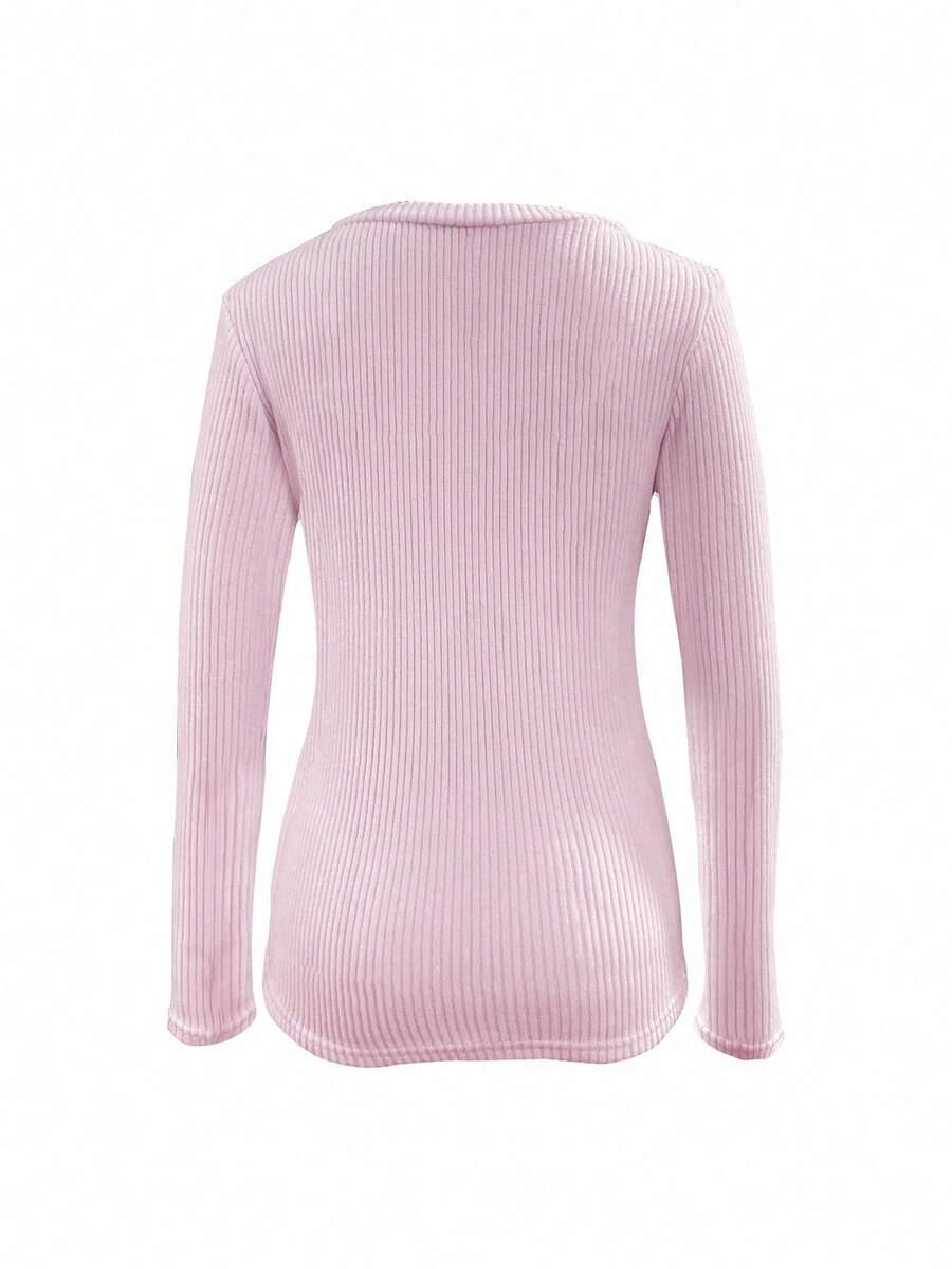 różowy sweter v-neck