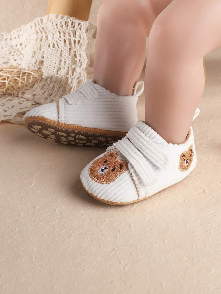 białe buty miś