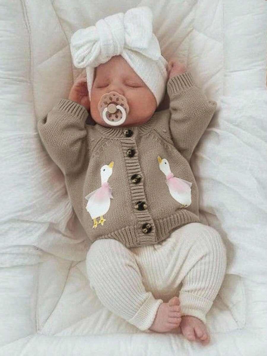 beżowy sweter guziki
