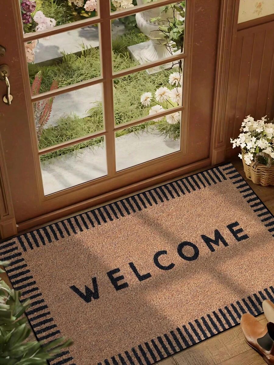 brązowa wycieraczka napis welcome