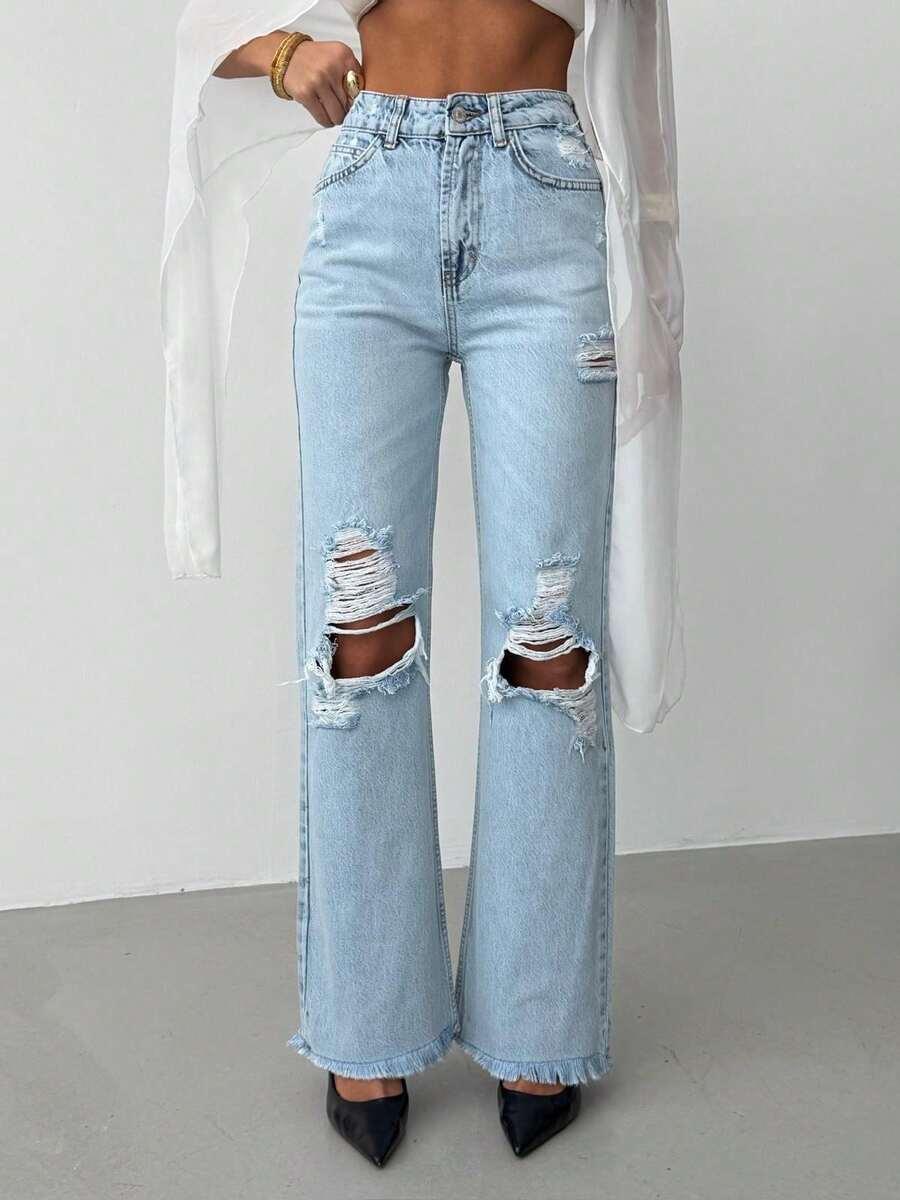 niebieskie spodnie jeans przetarcia