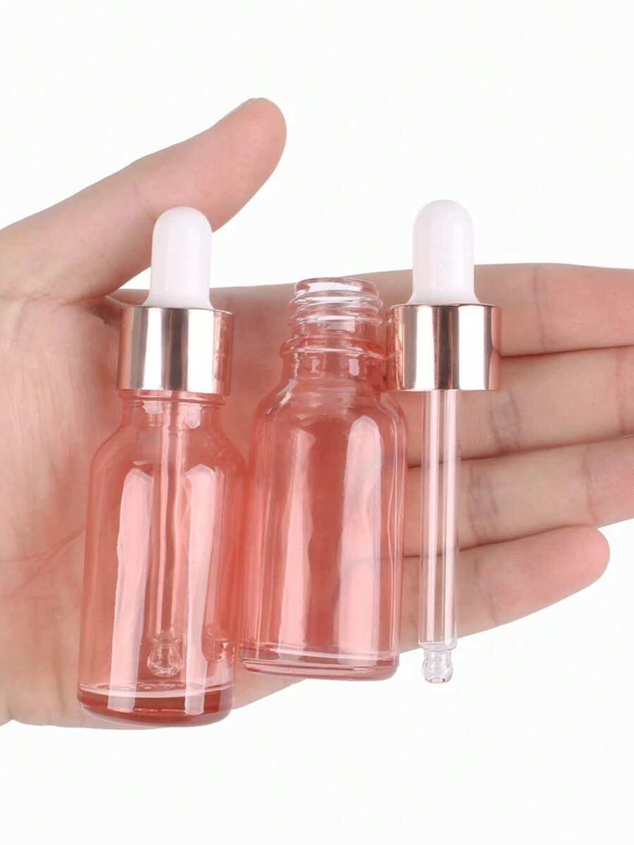 Różowa butelka szklana z pipetą 