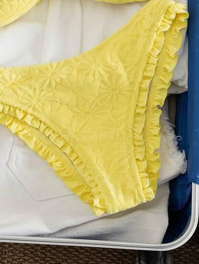 żółty dwuczęściowy strój kąpielowy tekstura
