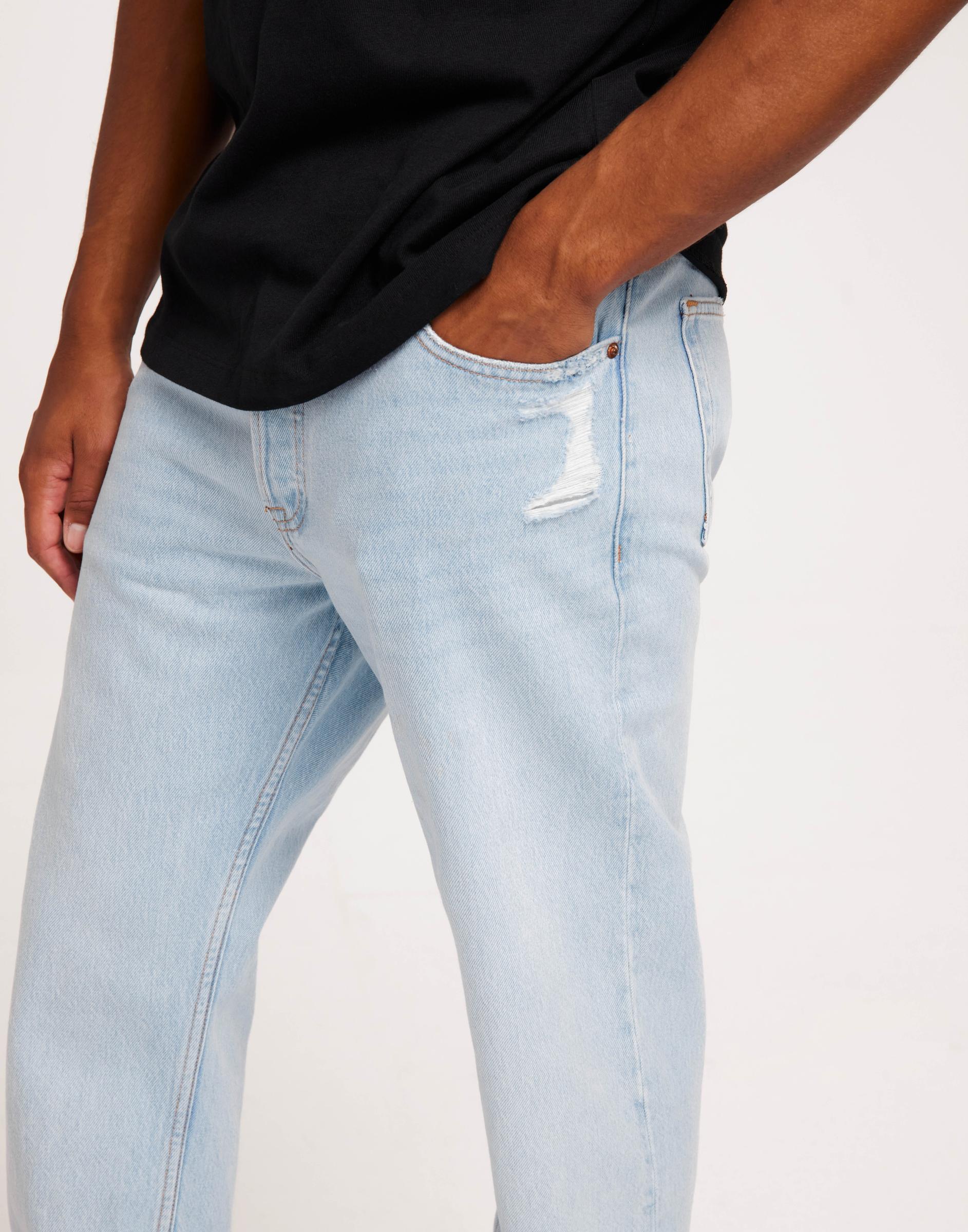niebieskie proste spodnie jeans ripped