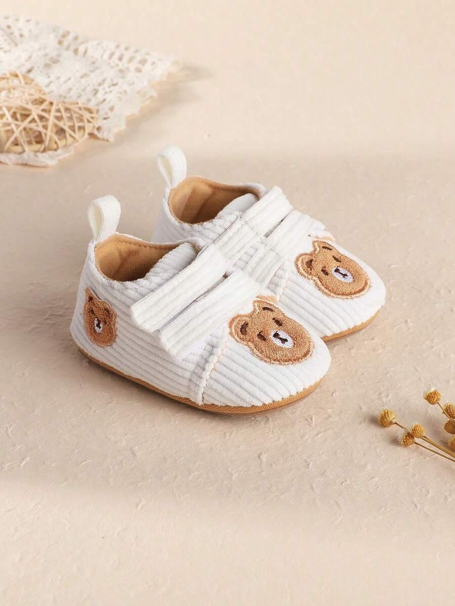 białe buty miś