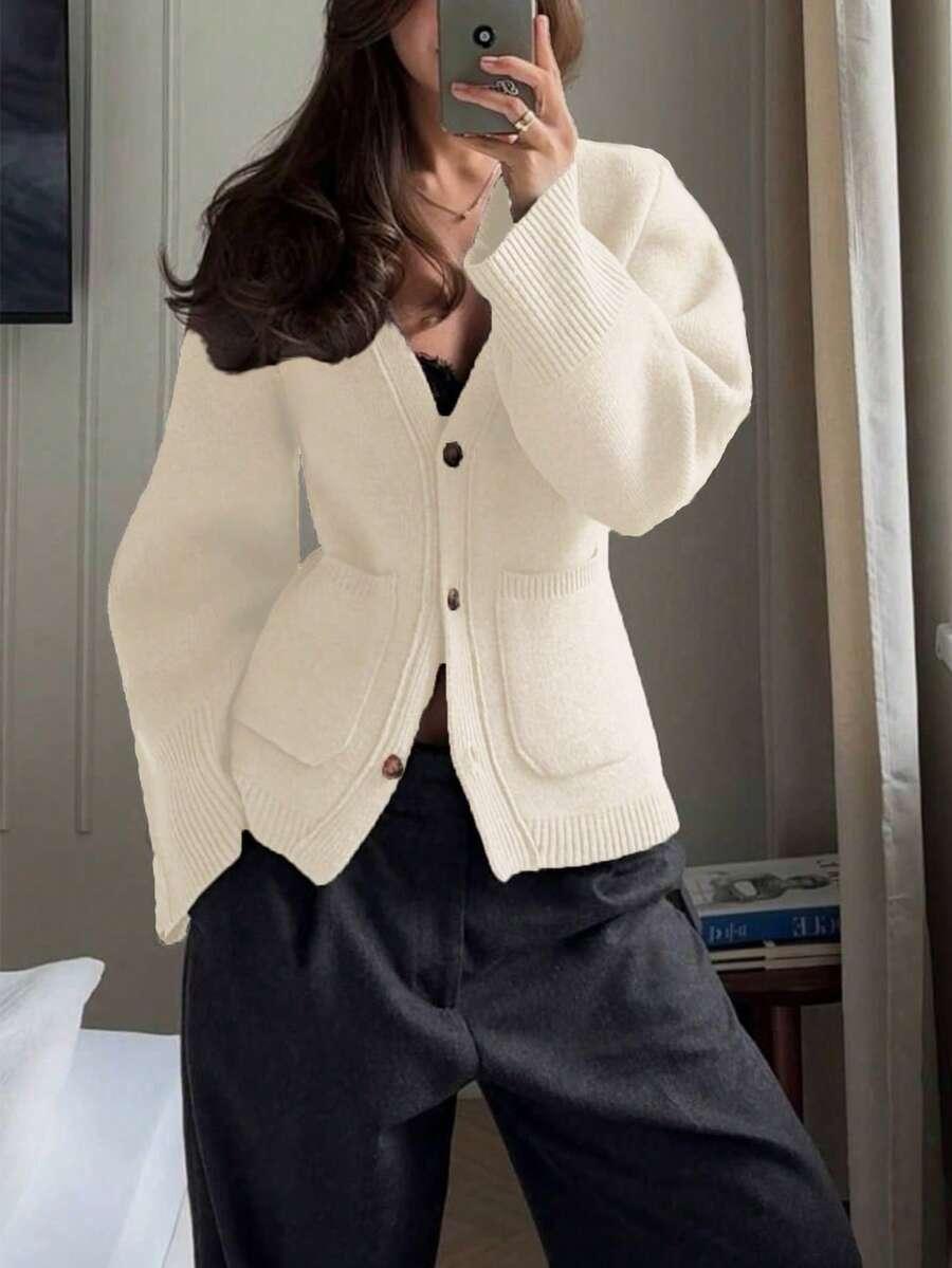 Beżowy sweter kieszonki