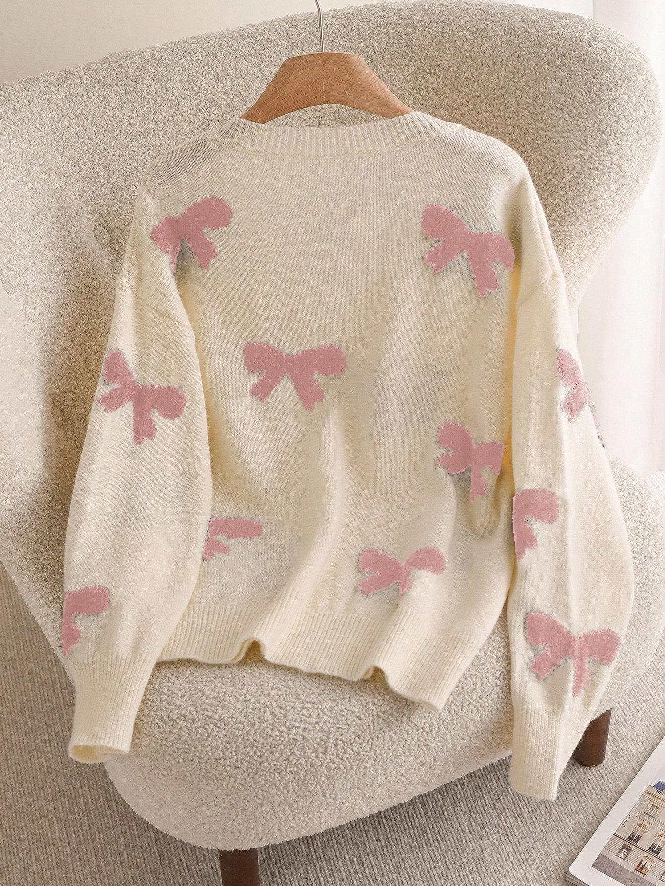 beżowy sweter kokardki