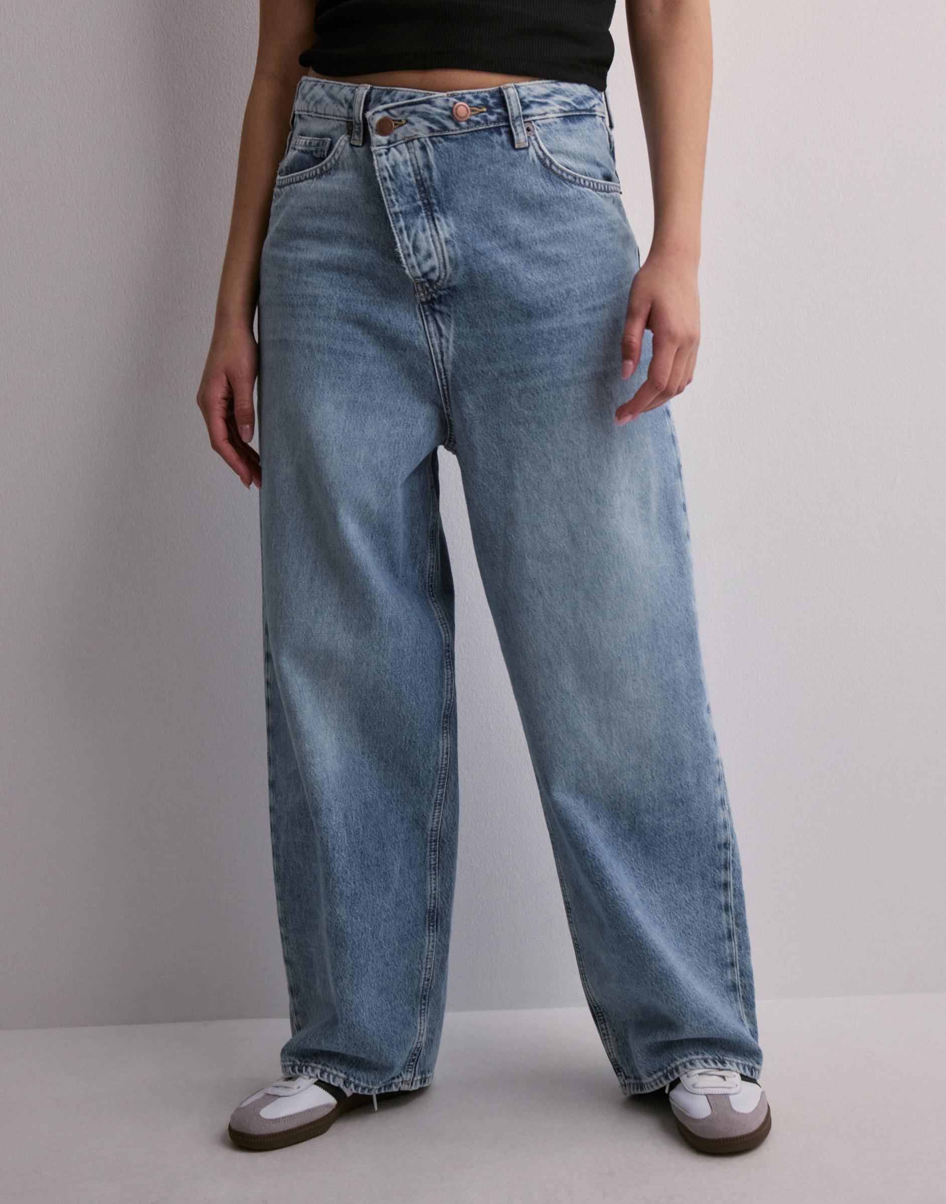 spodnie wide leg jeans kieszenie asymetria guziki