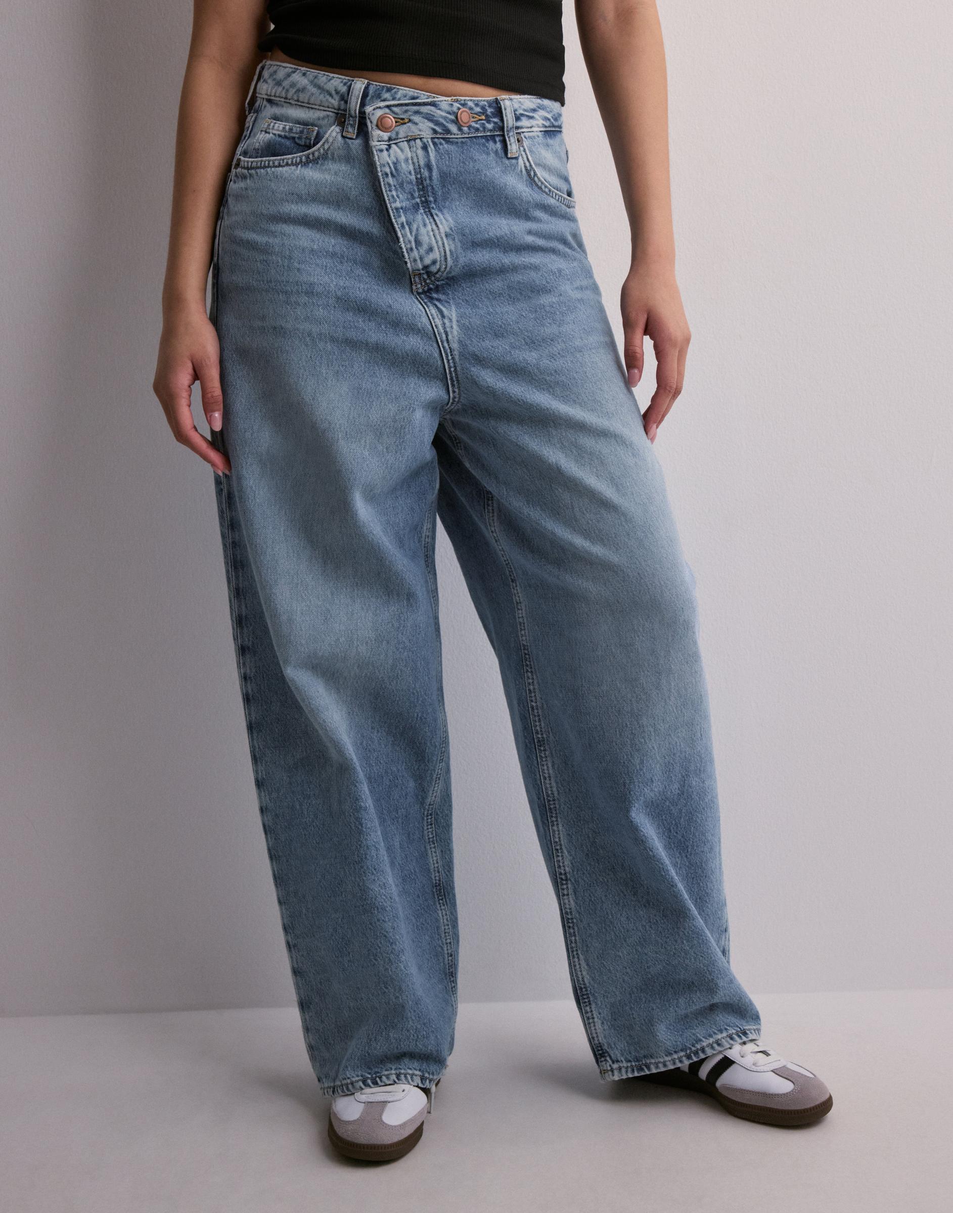 spodnie wide leg jeans kieszenie asymetria guziki