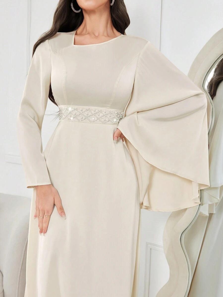 ELEGANCKA SUKIENKA Z ROZSZERZANYMI RĘKAWAMI