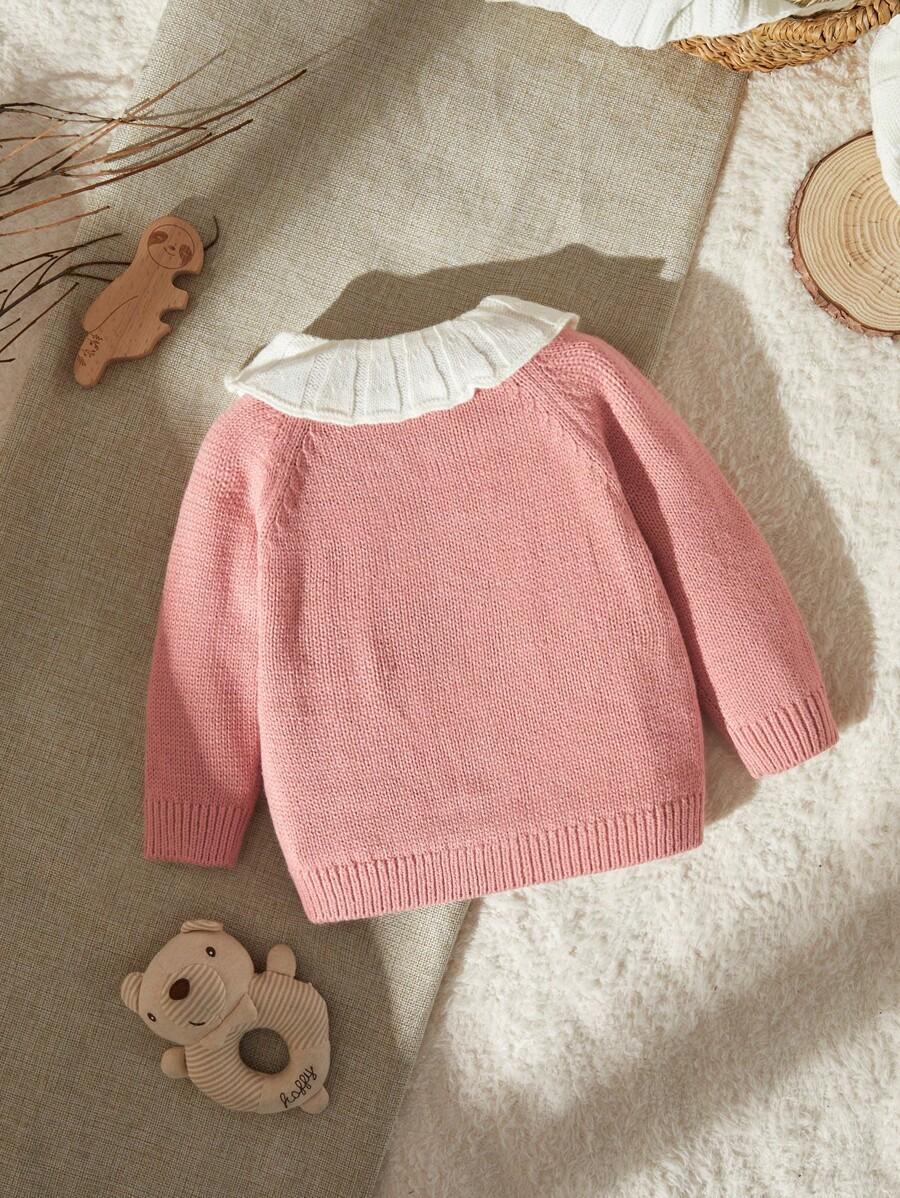różowy sweter wzór