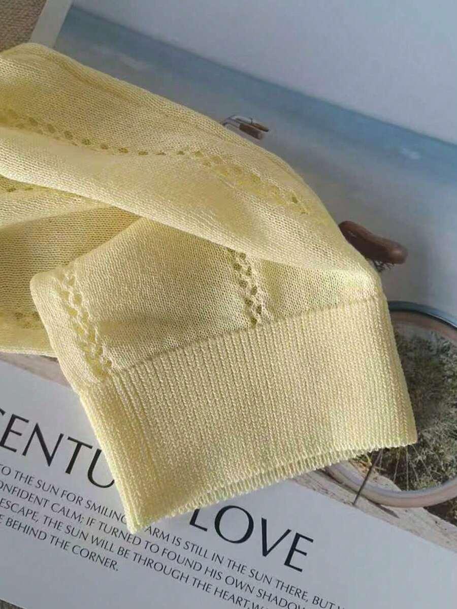 żółty sweter guziki 