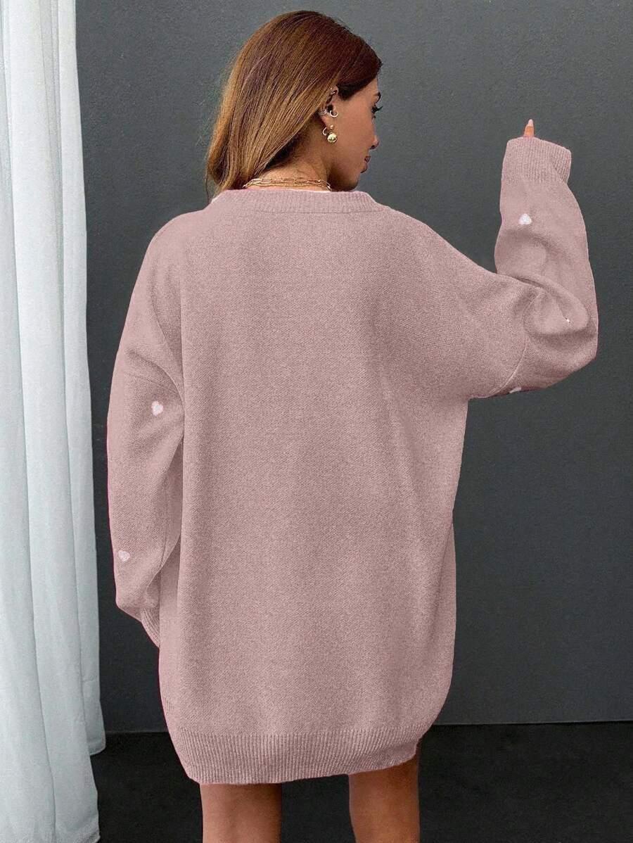 różowy sweter wzór serca
