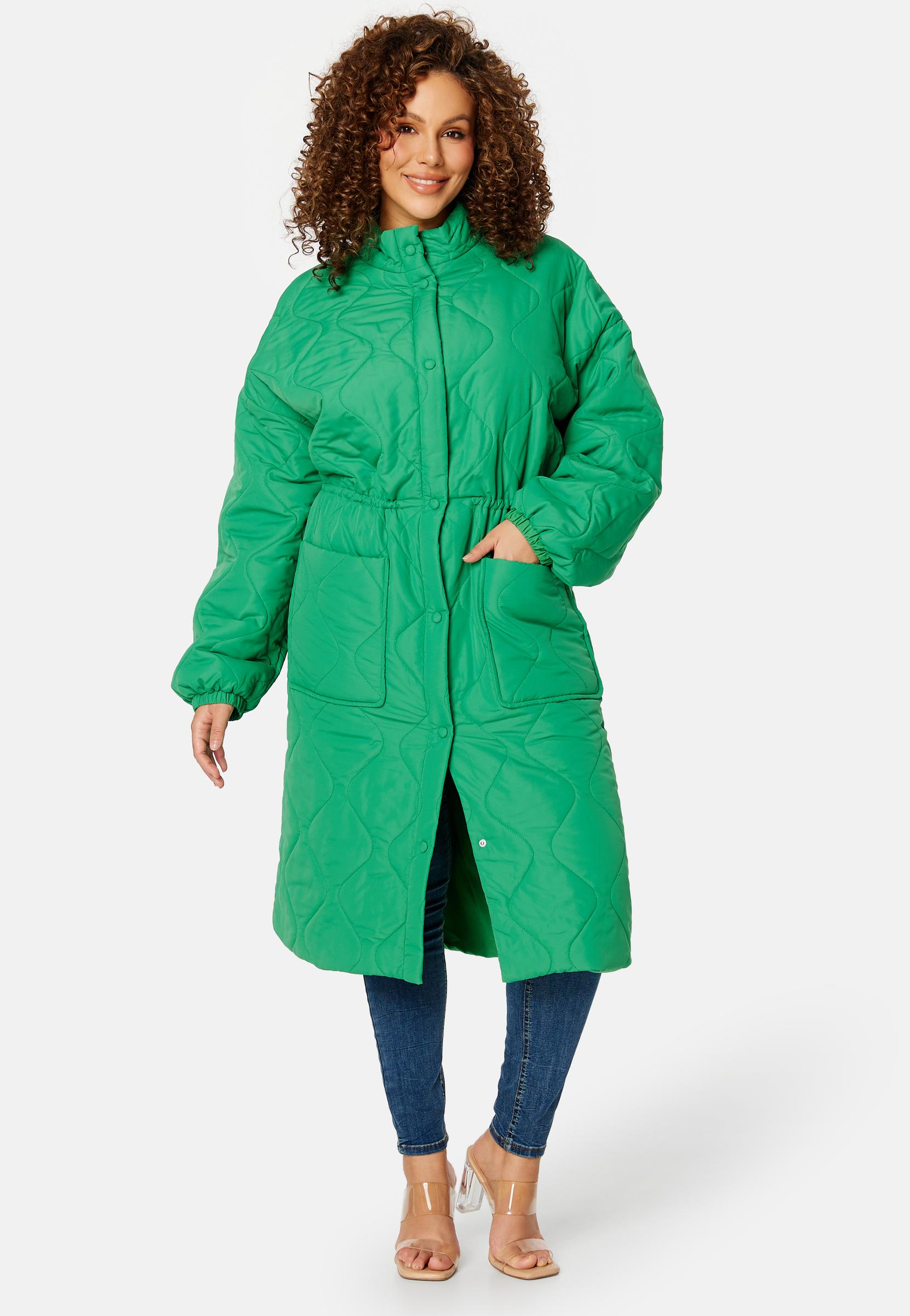 zielony pikowany płaszcz kieszenie