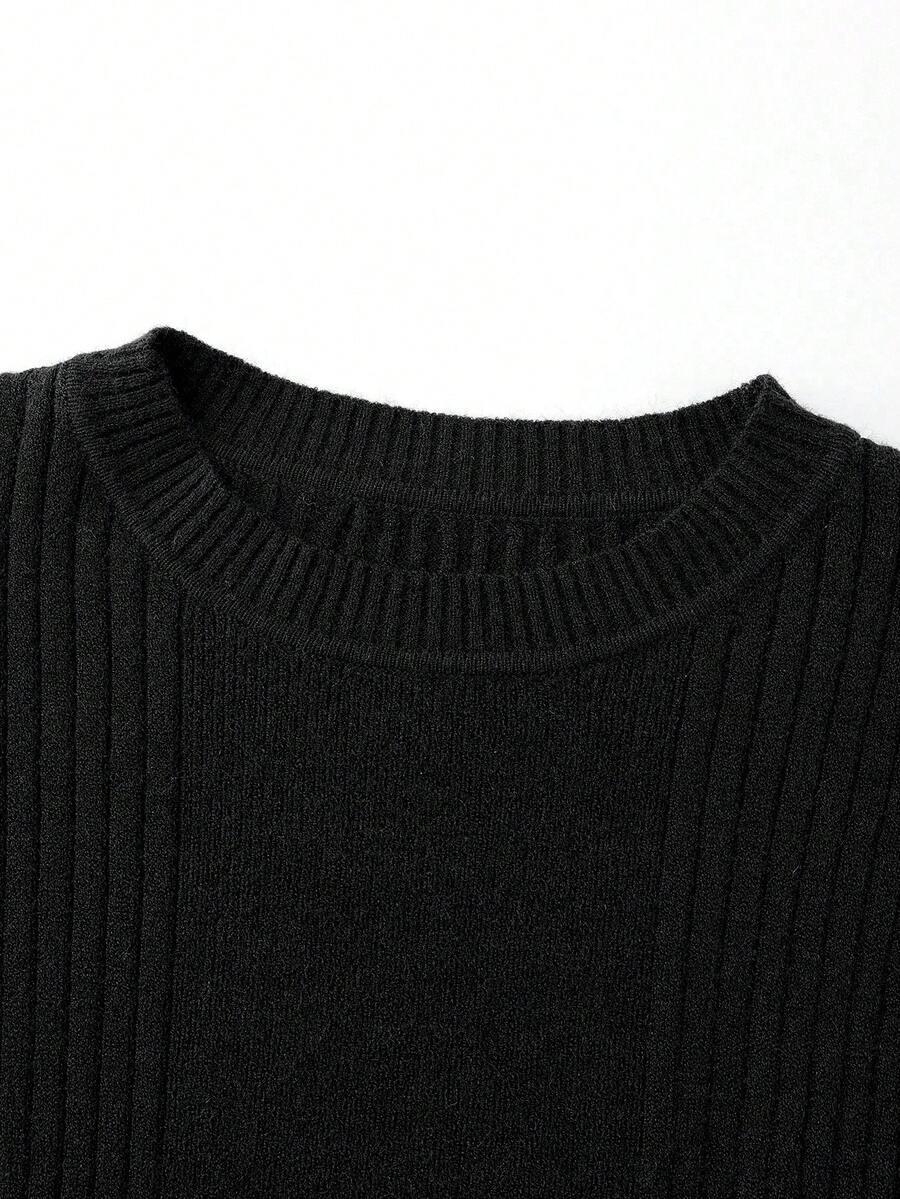 czarny sweter falbana