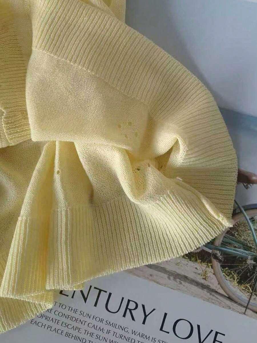 żółty sweter guziki 