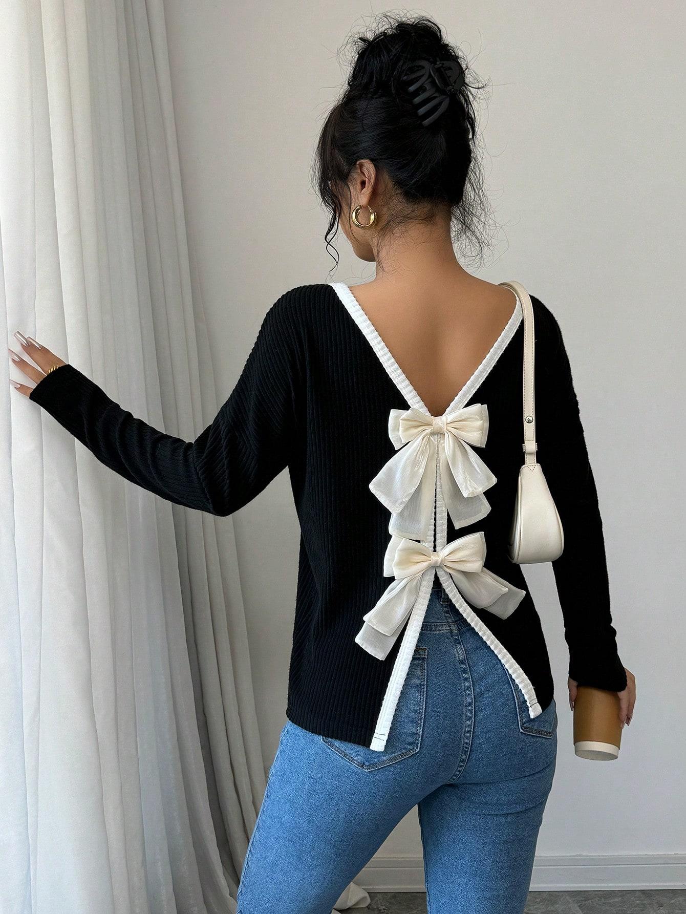 CZARNY SWETER KOKARDY 