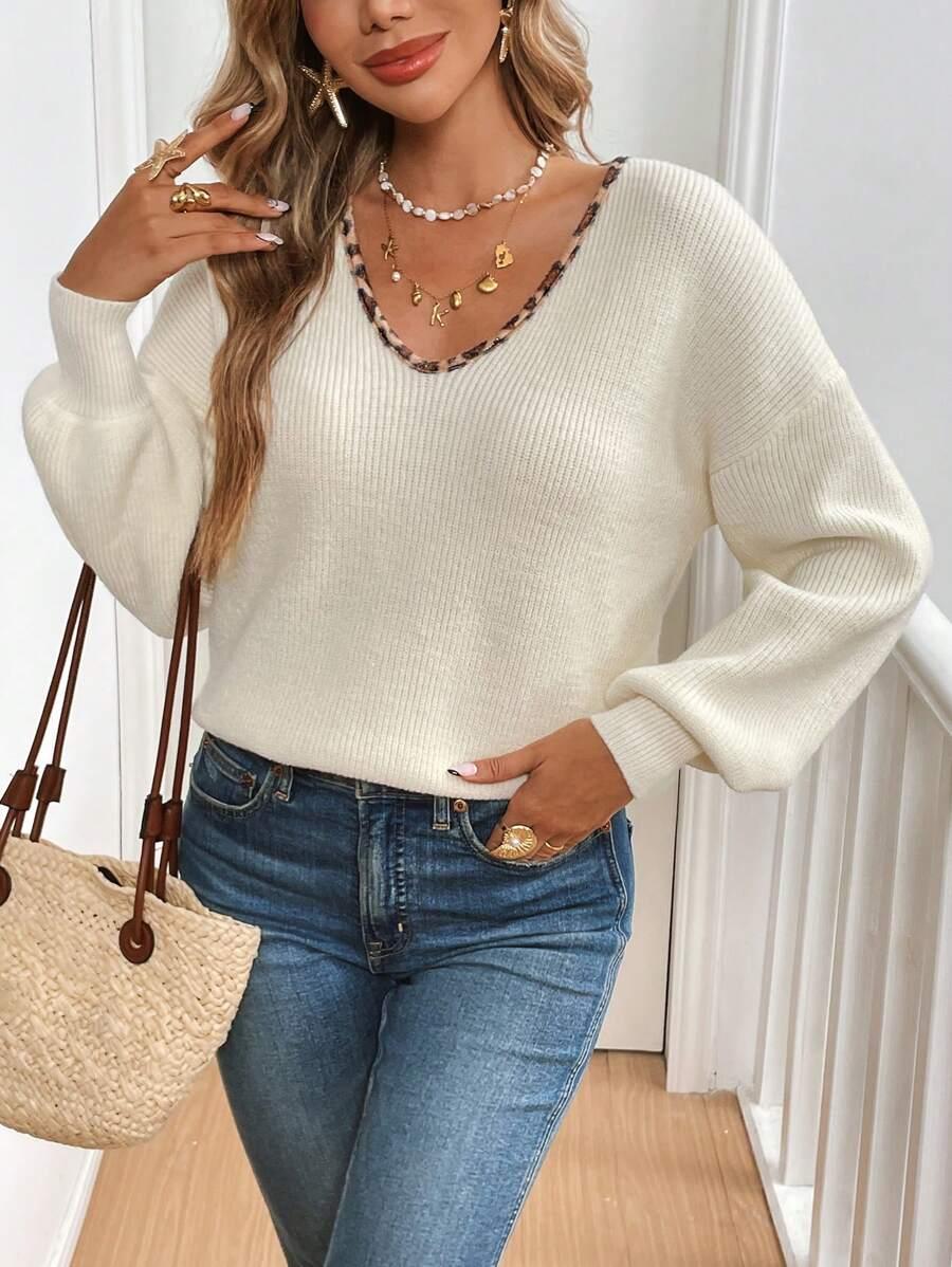 kremowy sweter v-neck