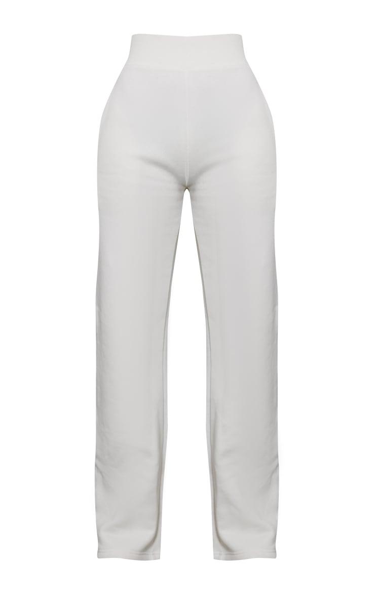 białe spodnie dresowe proste nogawki