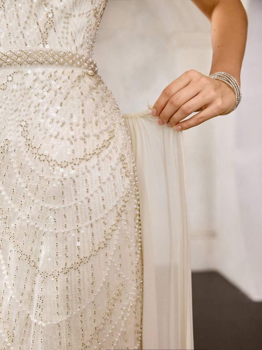 DŁUGA SUKIENKA Z OKRĄGŁYM DEKOLTEM I HAFTOWANYMI CYRKONIAMI