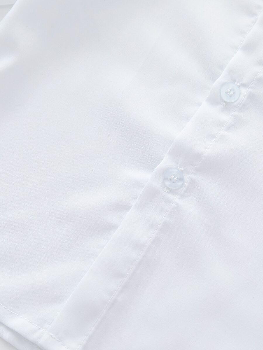 biała koszula guziki