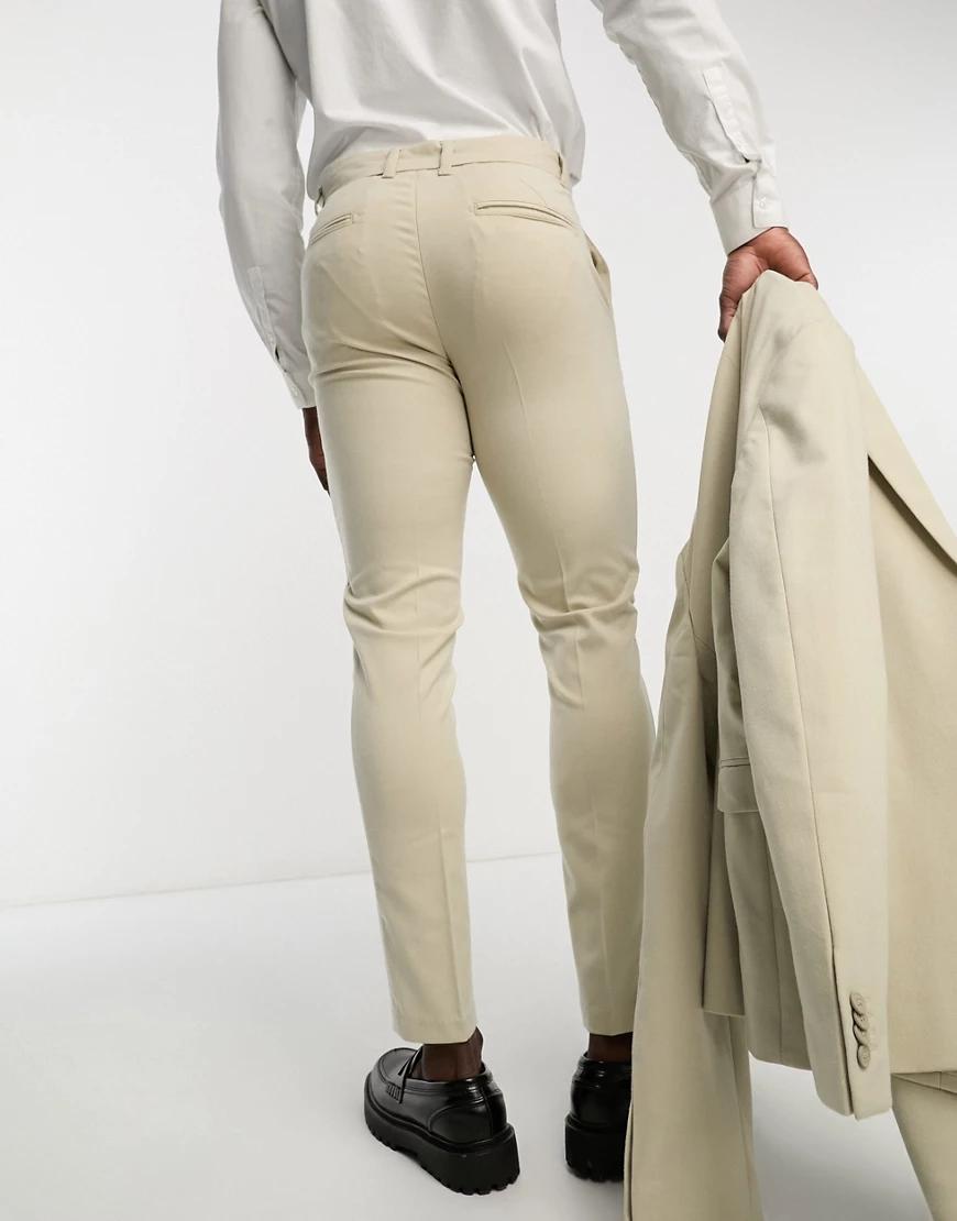 beżowe eleganckie spodnie skinny kieszenie
