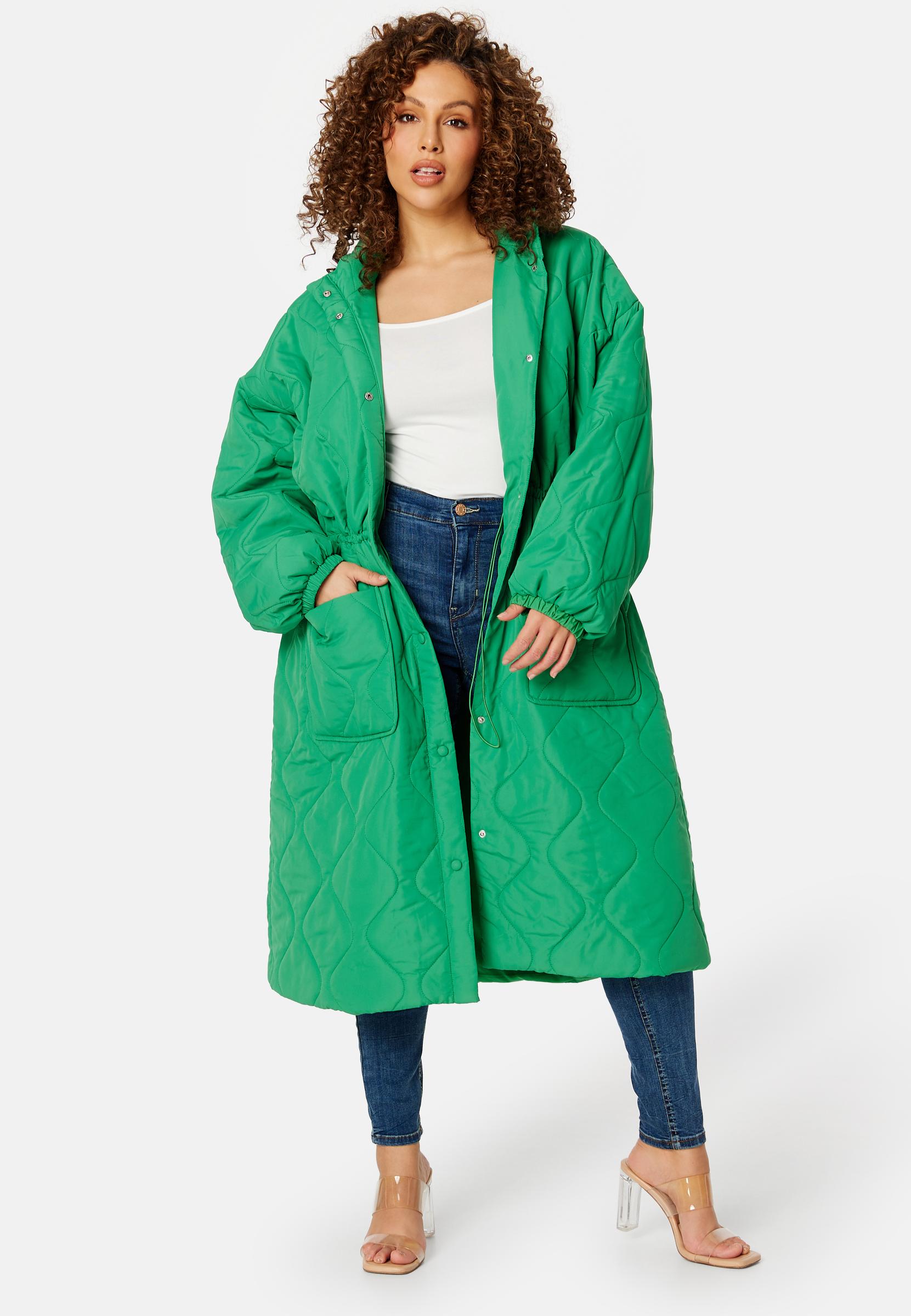 zielony pikowany płaszcz kieszenie