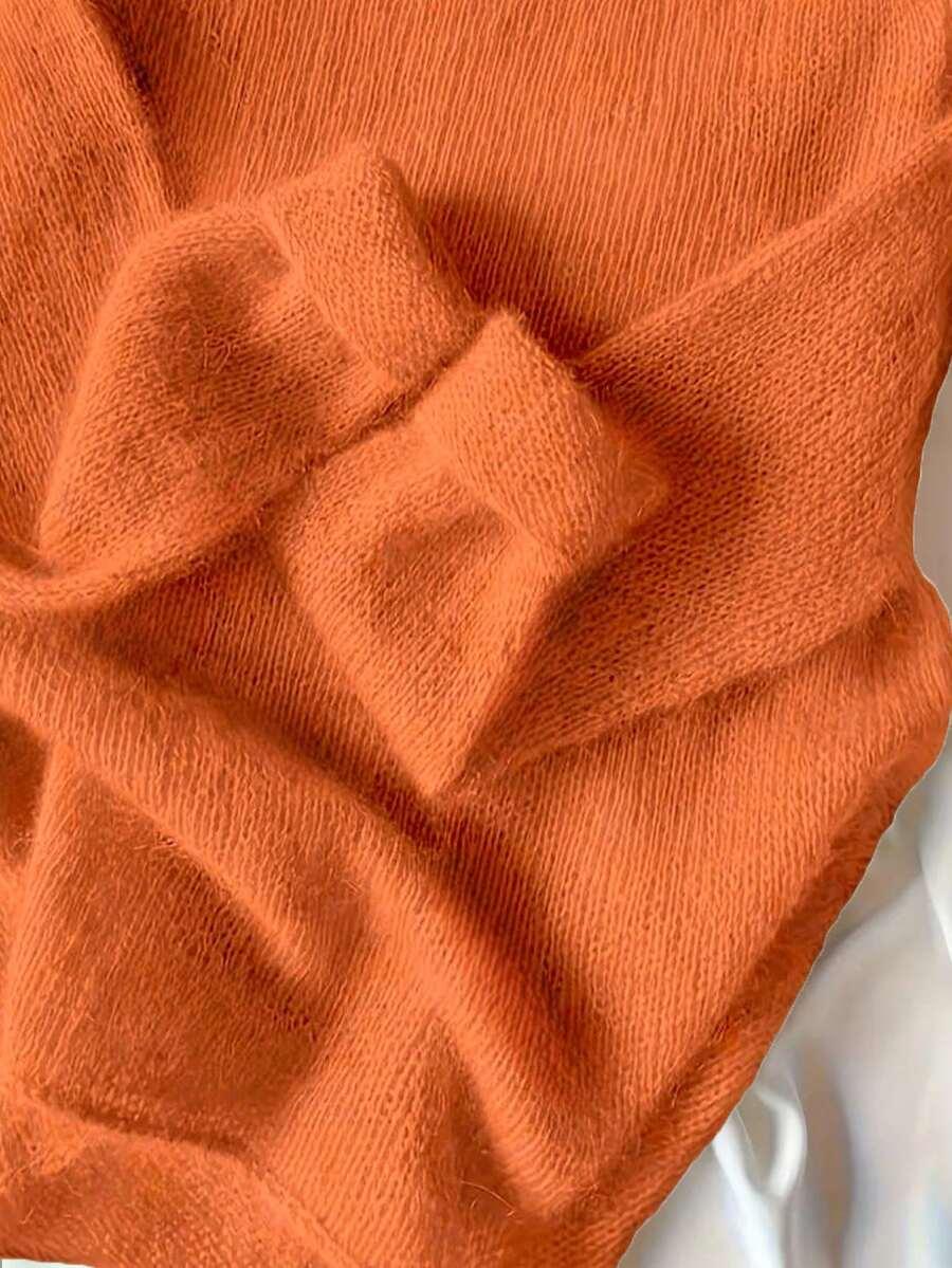 pomarańczowy sweter okrągły dekolt