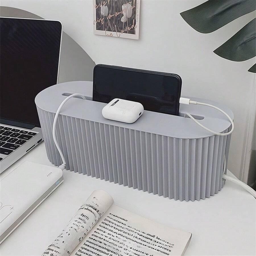 szary organizer na kable