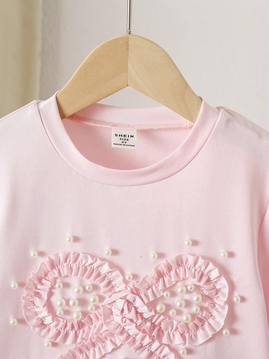 różowy t-shirt kokarda