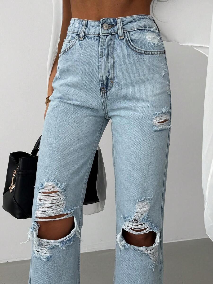 niebieskie spodnie jeans przetarcia