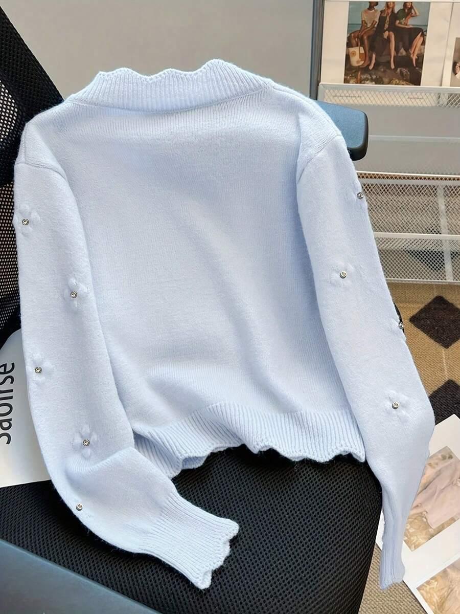 NIEBIESKI SWETER ZDOBIENIA