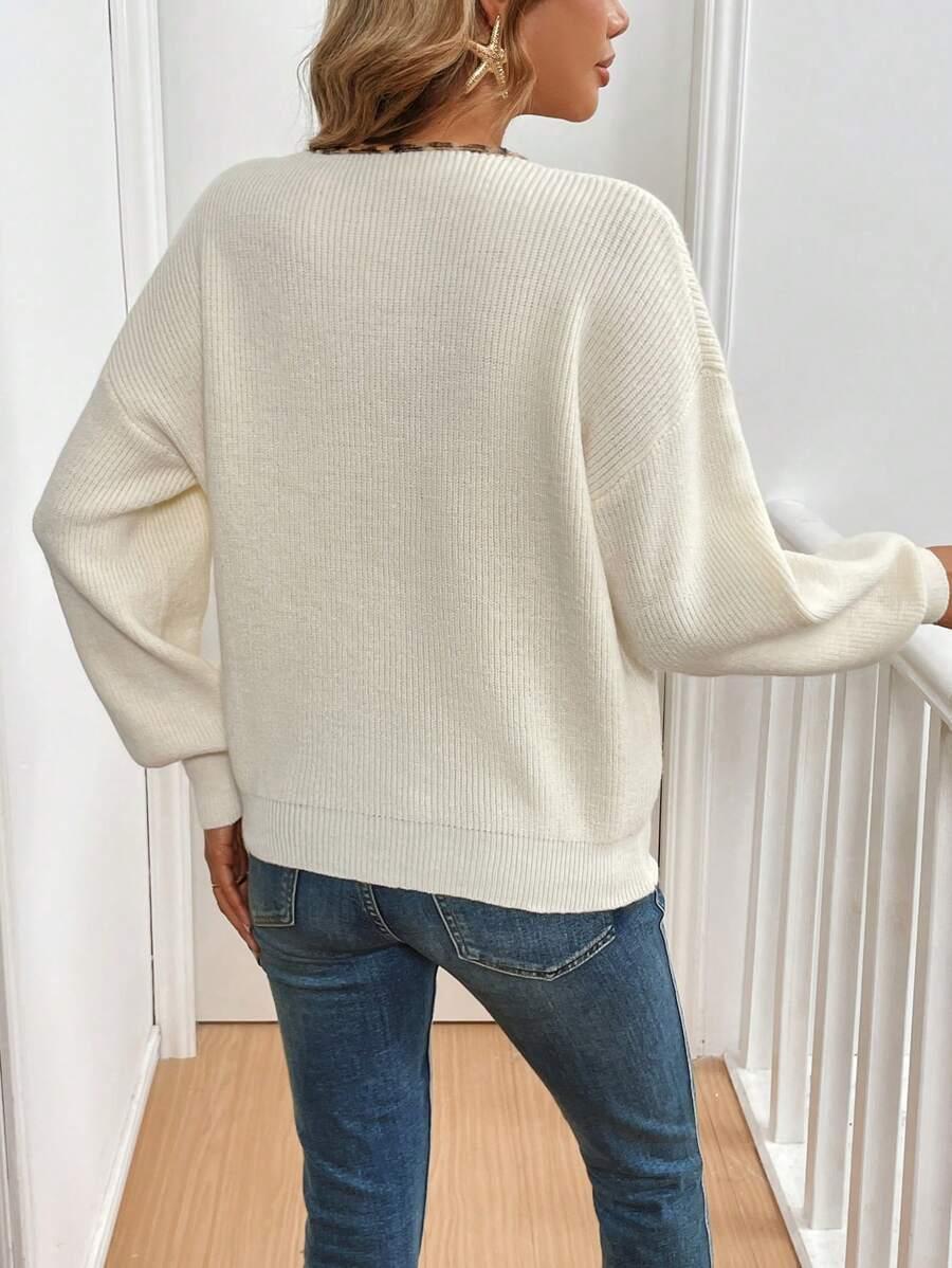 kremowy sweter v-neck