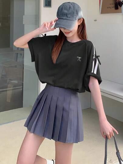 T-SHIRT Z OZDBONYMI WSTĄŻKAMI