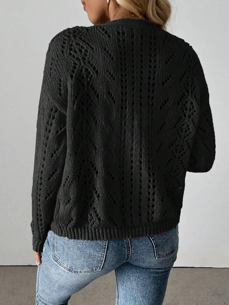 czarny sweter guziki