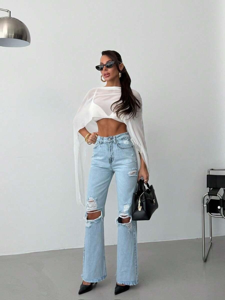 niebieskie spodnie jeans przetarcia