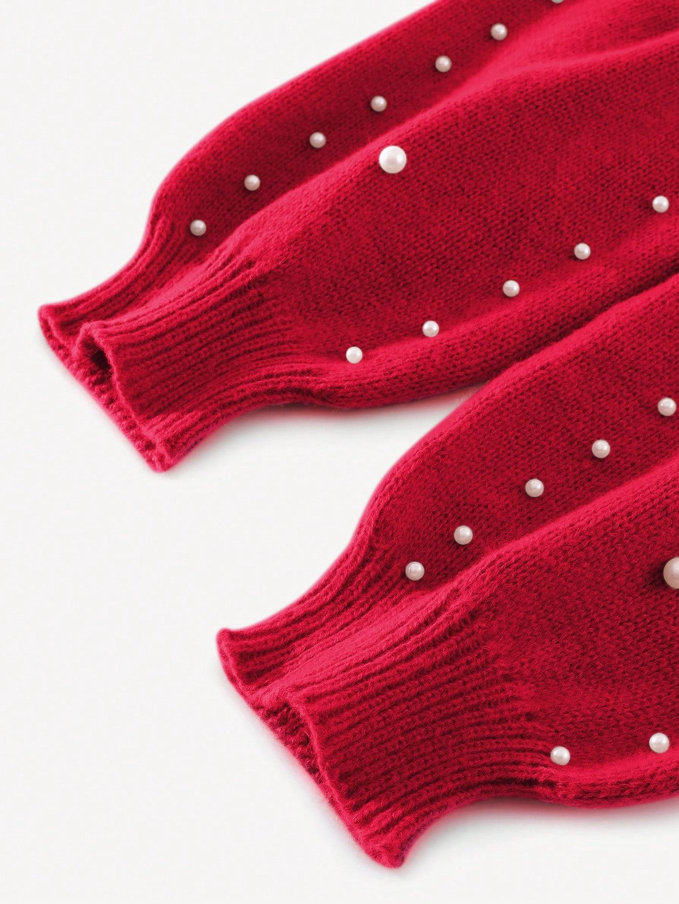 czerwony sweter zdobienie