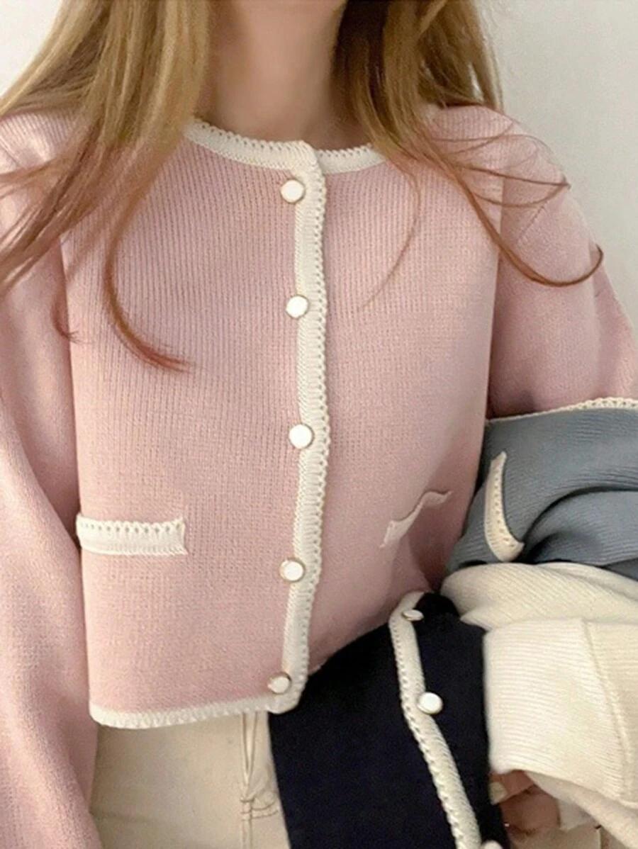różowy sweter guziki