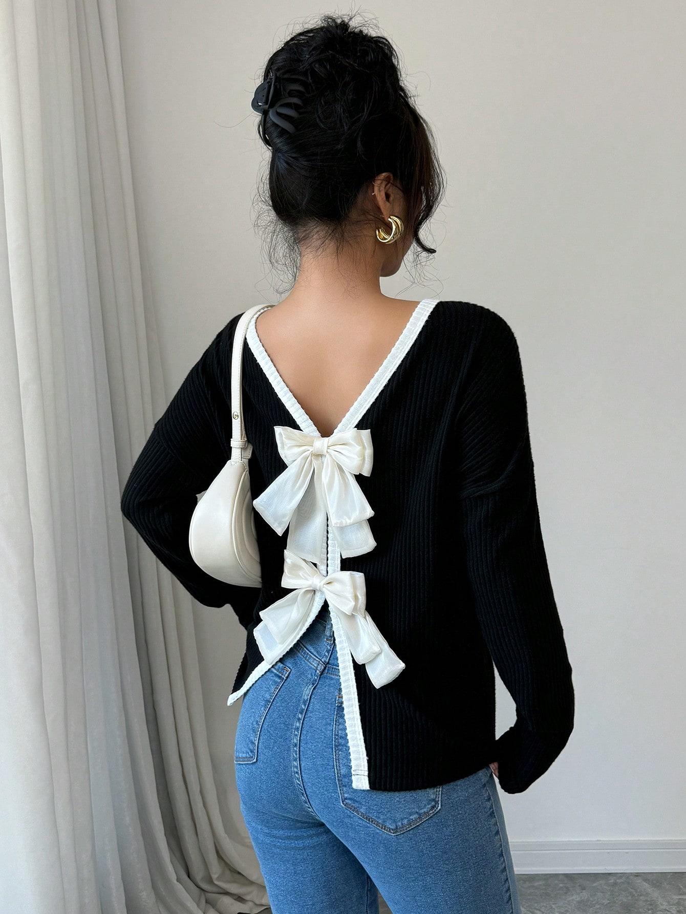 CZARNY SWETER KOKARDY 