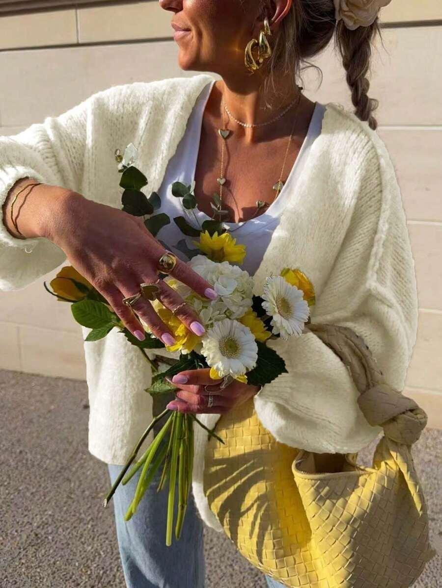 kremowy dzianinowy sweter 