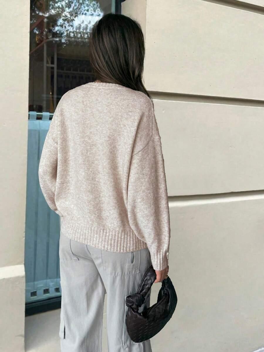 beżowy sweter oversize
