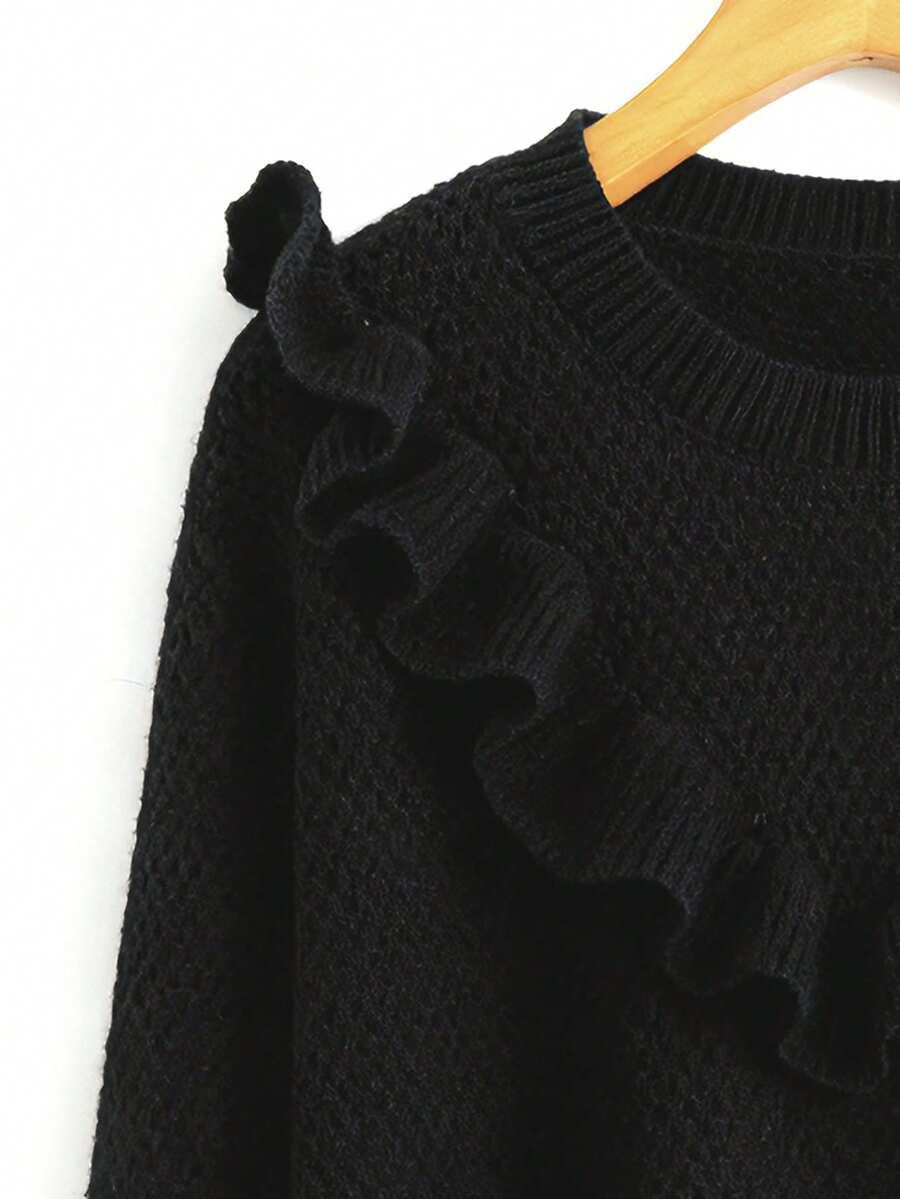czarny sweter falbana