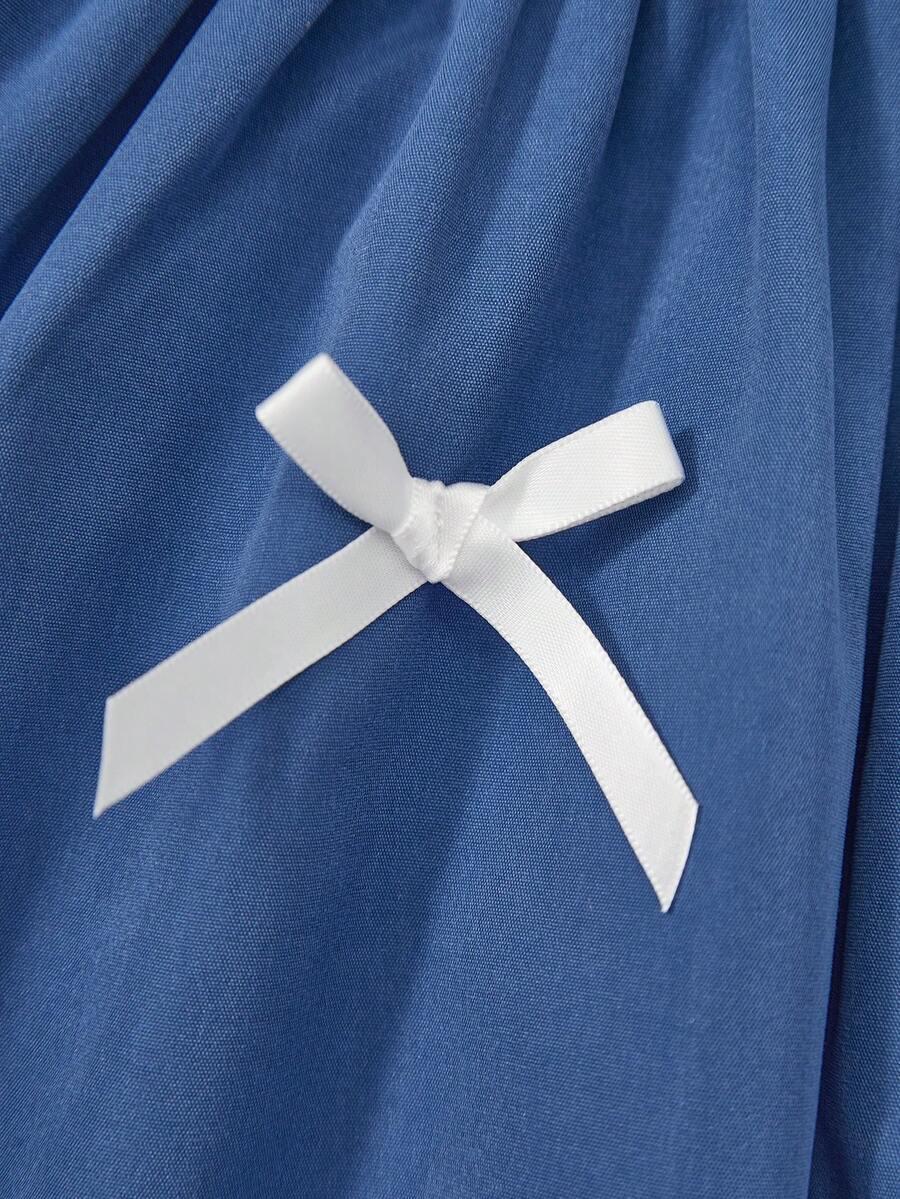 niebieska sukienka kokardy