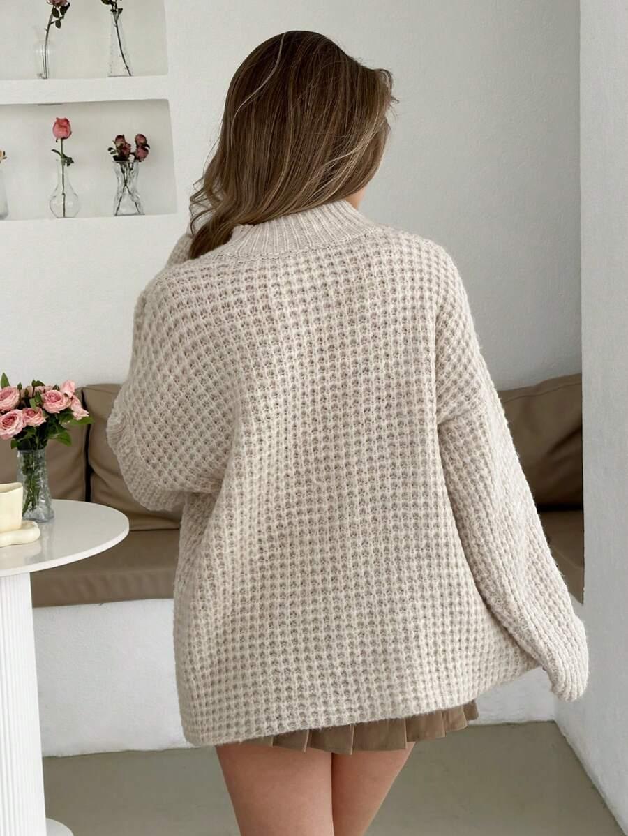 klasyczny beżowy sweter tekstura
