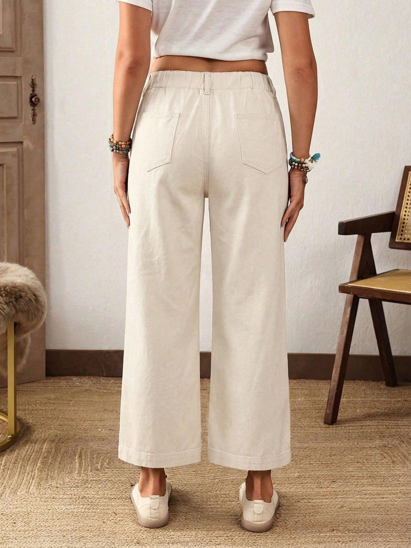 kremowe spodnie jeans