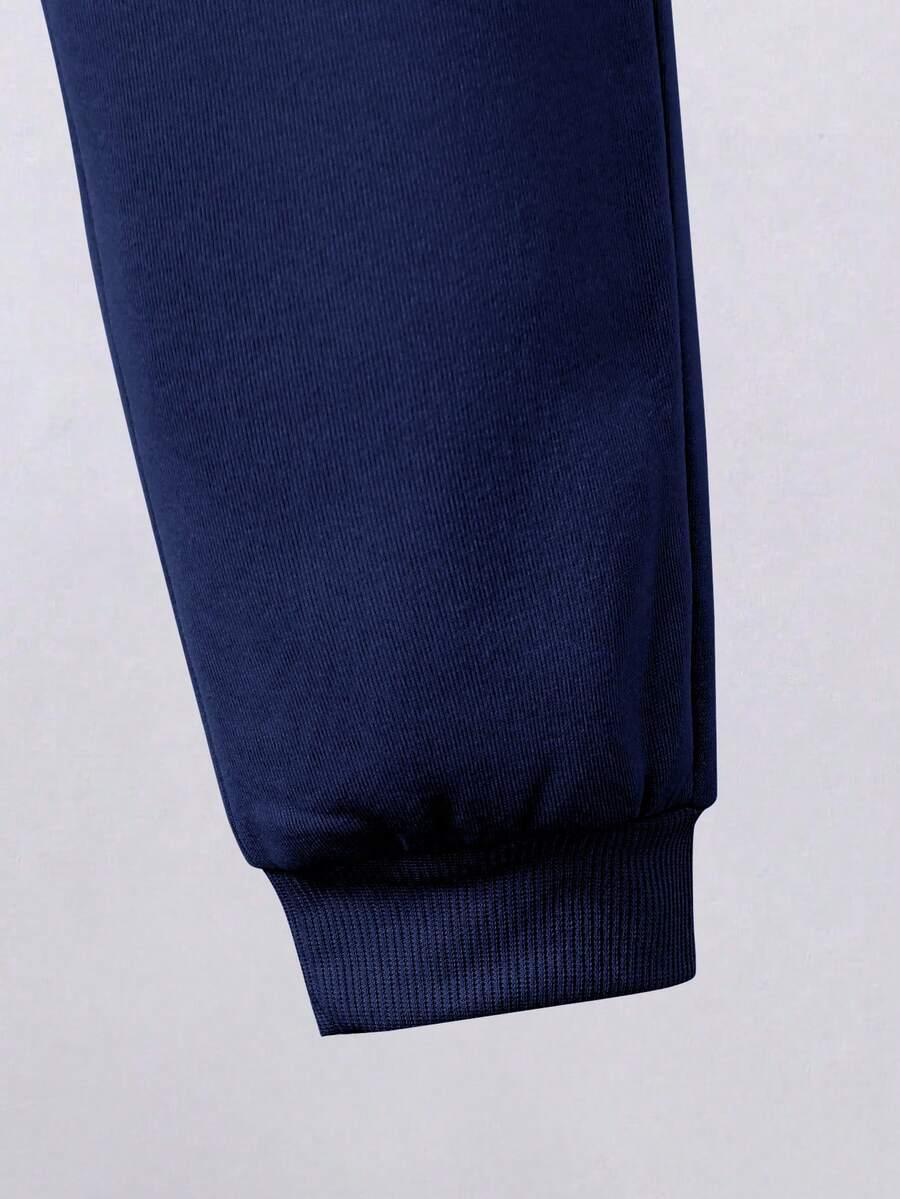 niebieski dresowy komplet bluza spodnie