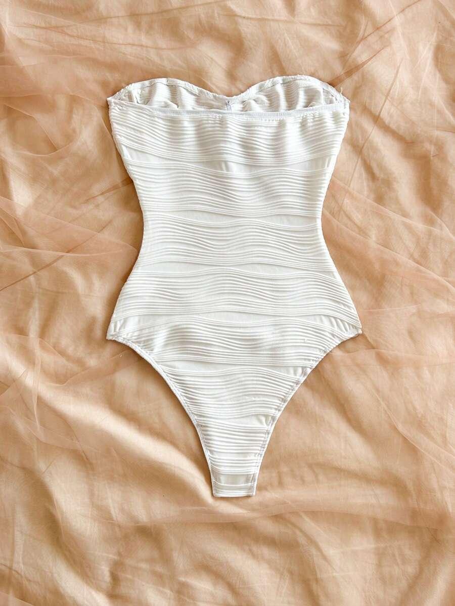 białe body zdobienie